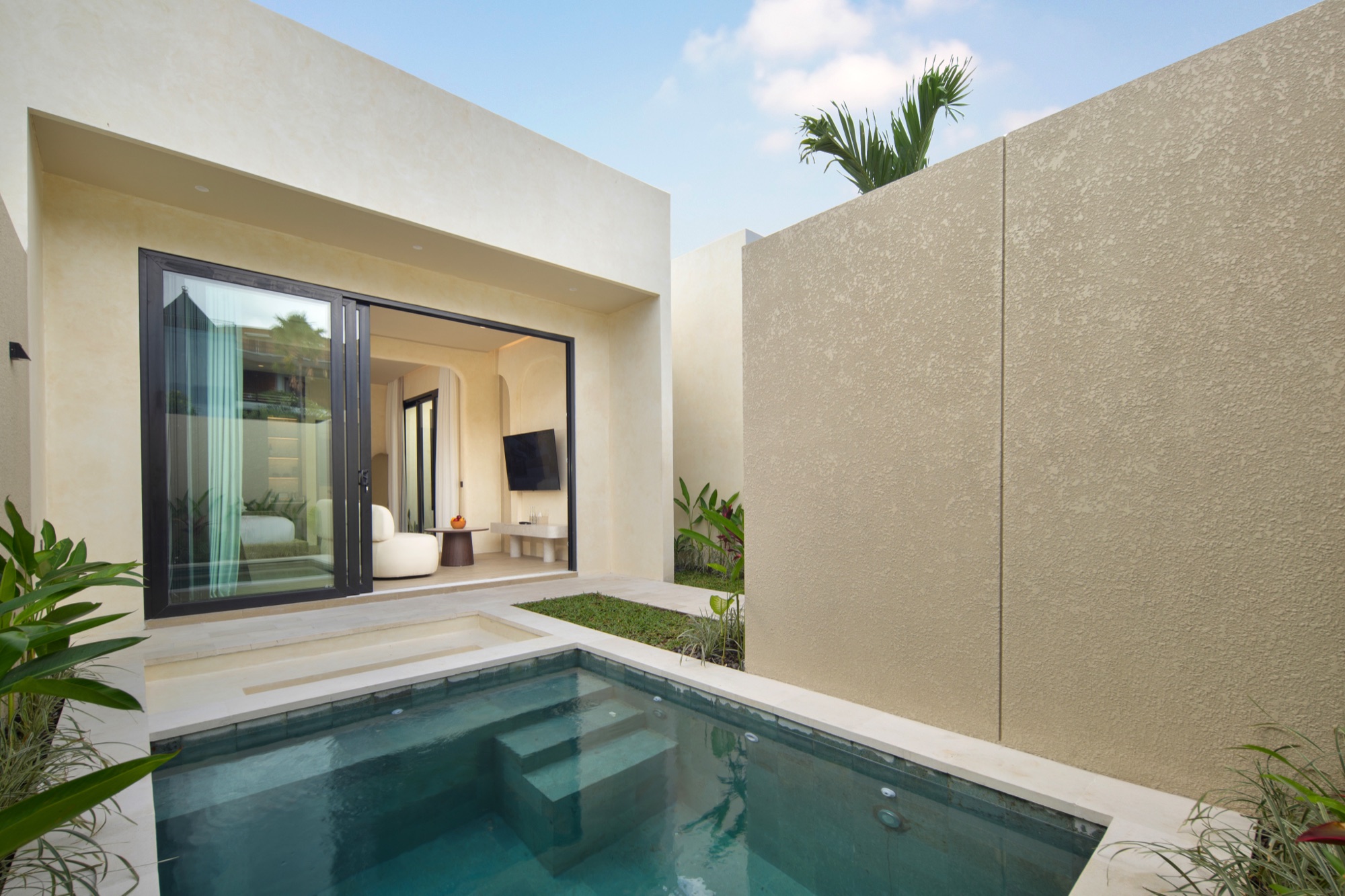 Lario Collection villa with a private plunge pool and sliding glass doors to the bedroom